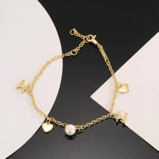 Celine Coeur Charm Bracelet In Gold-Tone Brass And Resin Pearl - Image 6